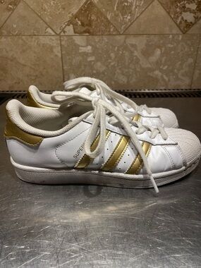 Adidas White Sneakers with Gold Stripes - Classic Shell Toe